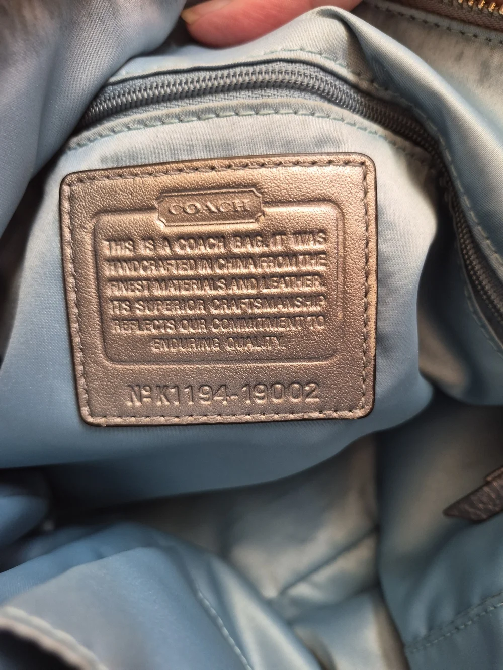 Coach sleek metallic